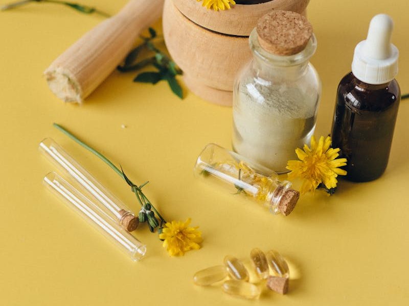 White Ceramic Condiment Shaker Beside Brown Wooden Mortar and Pestle